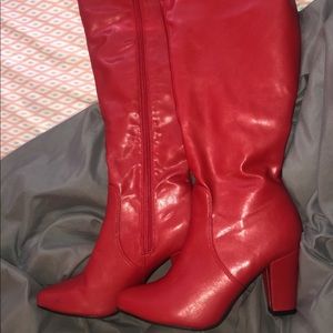 Thigh high red leather boots